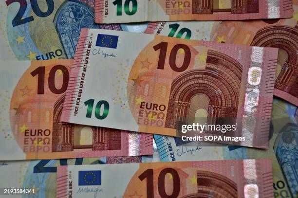 In this photo illustration, euro banknotes seen displayed on a table. French bank fees will increase in 2025. Account maintenance fees, bank cards...