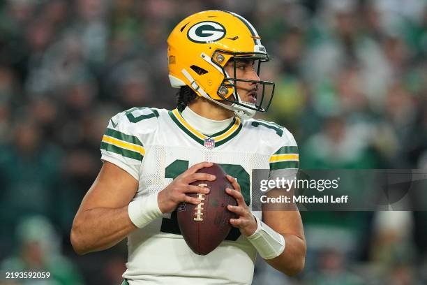 Jordan Love of the Green Bay Packers looks on in the first quarter of a game against the Philadelphia Eagles during the NFC Wild Card Playoff at...