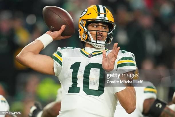 Jordan Love of the Green Bay Packers throws a pass in the first quarter of a game against the Philadelphia Eagles during the NFC Wild Card Playoff at...