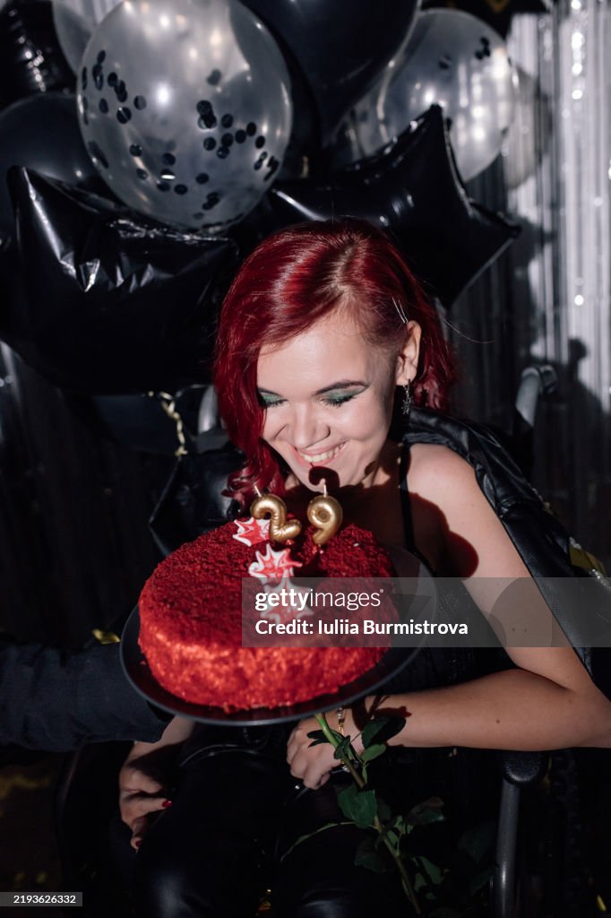 Celebrating a milestone birthday with a cake and joy in a festive wheelchair event