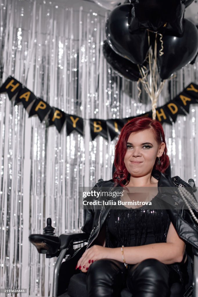 Celebrating a milestone birthday with joy and style in a decorated venue featuring black and silver decorations
