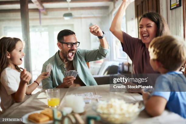 winner vs. looser in playing cards! - man playing poker stock pictures, royalty-free photos & images