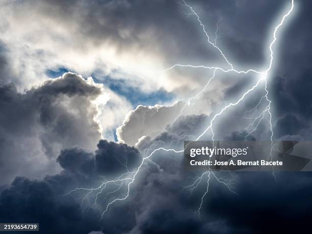 overcast sky with storm clouds, lightning and electrical discharges. - extreme weather stock pictures, royalty-free photos & images