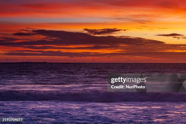 Java And West Java Coast The sun sets over the South Coast of West Java in Santolo Beach ...