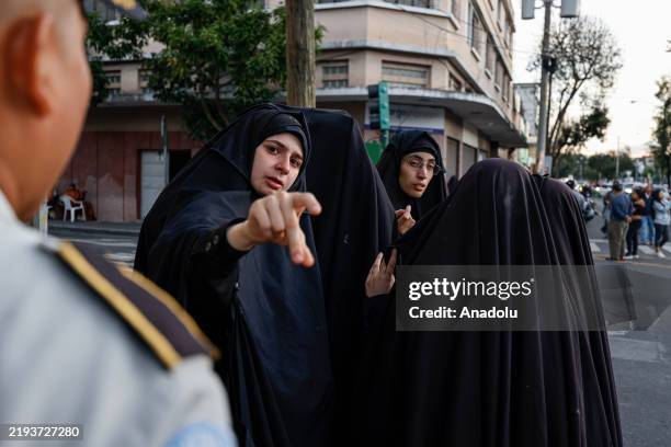 Members of the Lev Tahor Jewish community participate in a demonstration outside the Alida Espana de Arana special school, where authorities have...