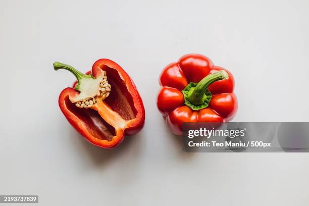 two red peppers isolated on a white background - red bell pepper stock pictures, royalty-free photos & images