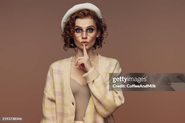 the whisper of silence: playful mystery in soft pastels - whisper quiet stock pictures, royalty-free photos & images