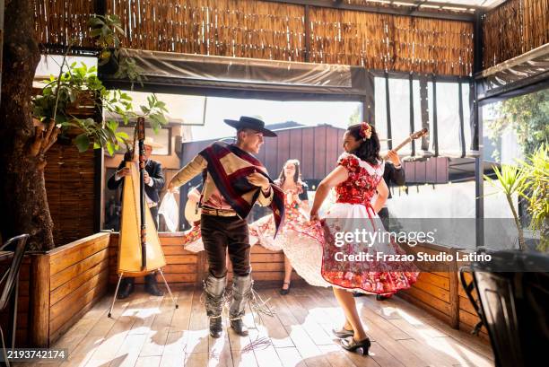 huasa and huaso dancing at a folkloric cueca event in chile - chile bildbanksfoton och bilder