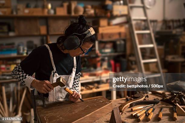 Gouges In The Workshop 1,618 Woman Construction Cutting Stock Photos, High-Res Pictures, and ...