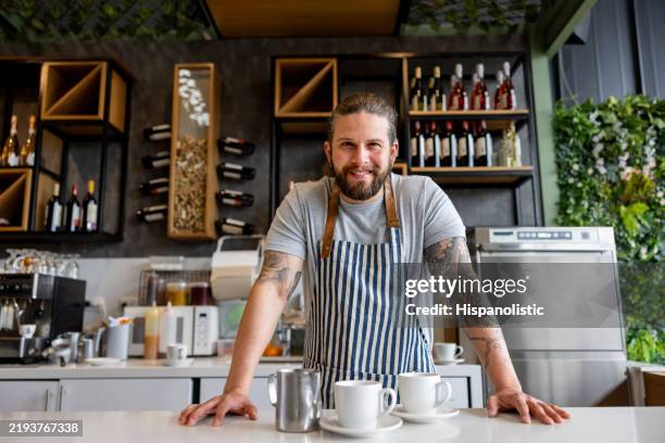 portrait of a barista working at a cafe - barista stock pictures, royalty-free photos & images