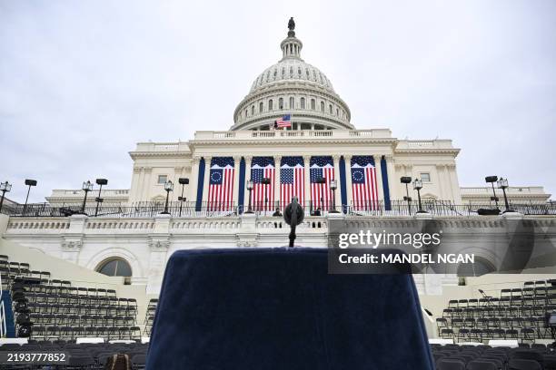Lectern and microphone stands on a platform stage on the West Front of the US Capitol building, where the presidential inauguration traditionally...