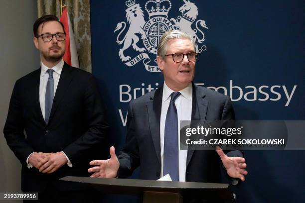 Britain's Prime Minister Keir Starmer speaks next to Polish Minister of State Assets Jakub Jaworowski as he attends a business reception at the...