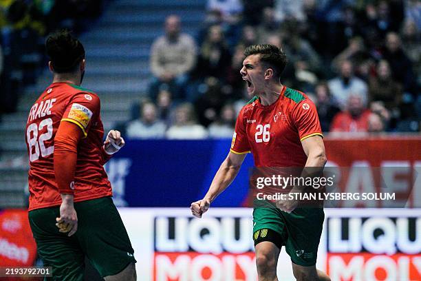 Portugal's right back Francisco Costa and Portugal's pivot Luis Frade celebrate during the Preliminary Round Group H match between Portugal and...