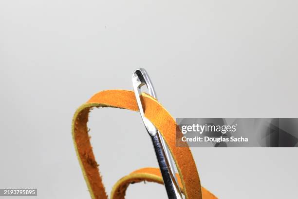 leather working tool for threading laces - travail du cuir photos et images de collection
