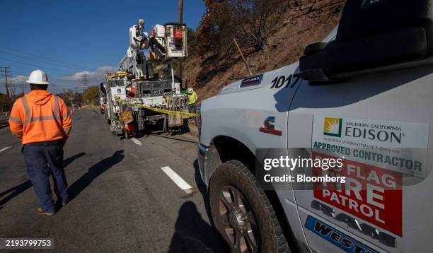 Southern California Edison Co. Contractors repair power poles after the Eaton Fire in Altadena, California, US, on Friday, Jan. 17, 2025. The Eaton...
