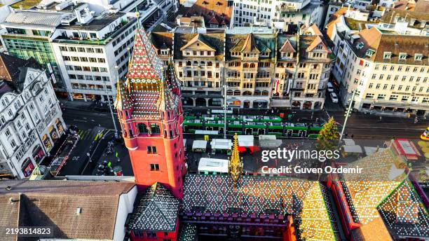 aerial view of basel town hall: the iconic red tower overlooking marketplatz amid a stunning cityscape of historic and modern architecture - marktplein stockfoto's en -beelden