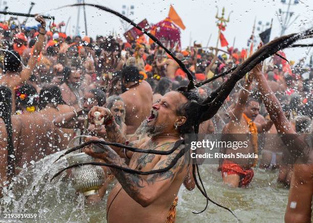 Naga Sadhus take a holy dip at Sangam, confluence of Ganges, Yamuna and mythological Saraswati rivers on the occasion of 'Makar Sankranti' the first...