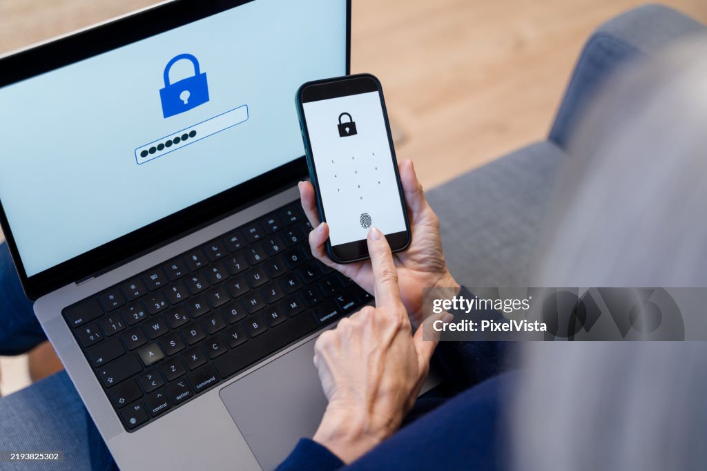 Senior adult using fingerprint scanner on smartphone for secure login