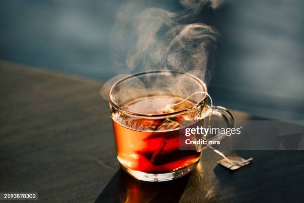 a glass cup of hot tea - tea fotografías e imágenes de stock