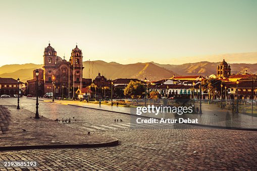 Street view of the golden sunrise over the Cusco Plaza de Armas architecture in Peru Street view of the golden sunrise over the Cusco Plaza de Armas architecture in Peru
