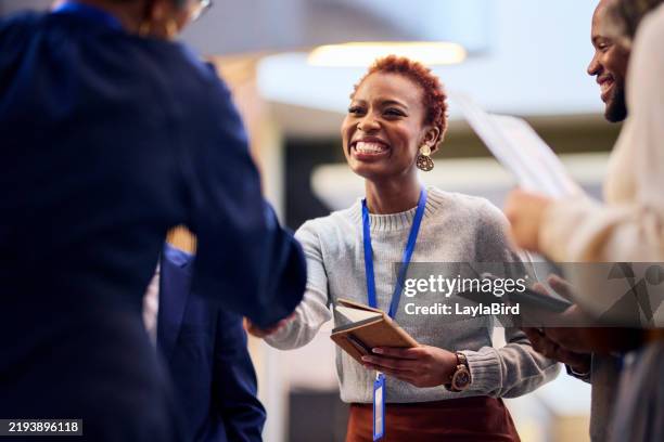 networking at a business conference - women shake hands stock pictures, royalty-free photos & images