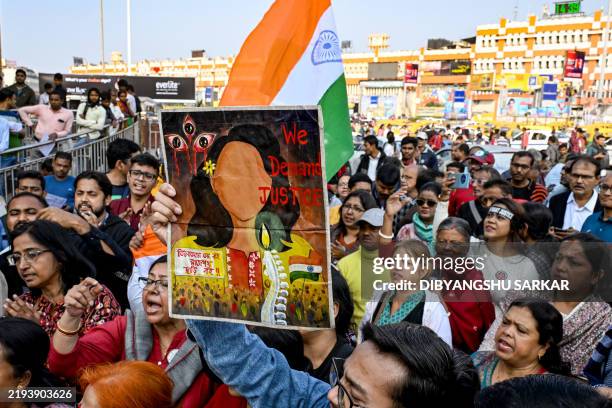 Social activists shout slogans near the Sealdah Civil and Criminal Court in Kolkata on January 18 where trial for the suspect of the rape and murder...