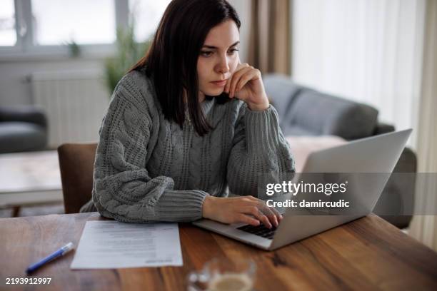 determined woman reviewing job opportunities online - cv bildbanksfoton och bilder
