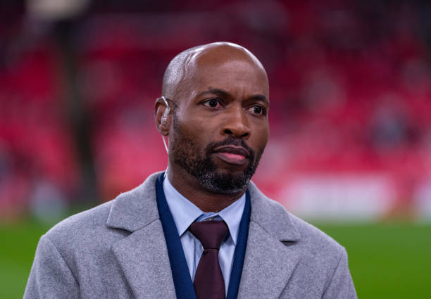 Reporter DaMarcus Beasley stands on the sideline before a game between England and the USWNT at Wembley Stadium on November 30, 2024 in London,...