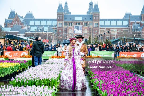 On National Tulip Day, visitors pick tulips for free from the picking garden with more than 200,000 colorful tulips at the Museumplein in Amsterdam,...
