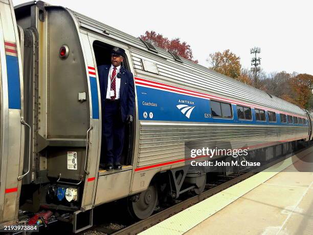 amtrak northeast regional passenger train, burke, virginia (usa - train guard stock pictures, royalty-free photos & images
