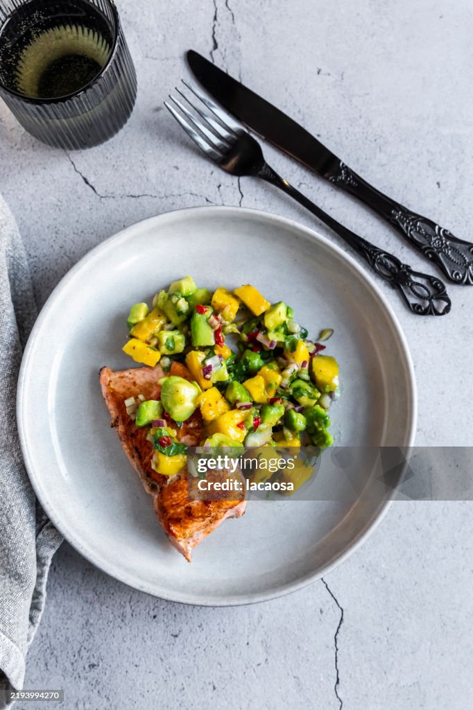 Roasted salmon with avocado-mango salsa