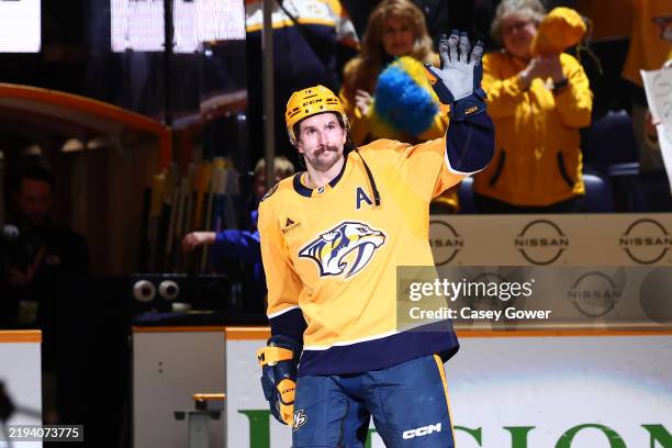 Filip Forsberg of the Nashville Predators skates onto the ice after being recognized as the third star of the game after the game against the...