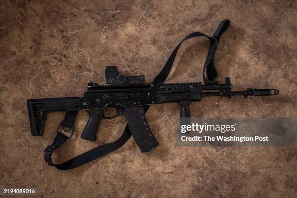 Russian AK-12 rifle found on a North Korean assaulting soldier in Russia's Kursk Region, is placed on a table to be photographed, at a military base...