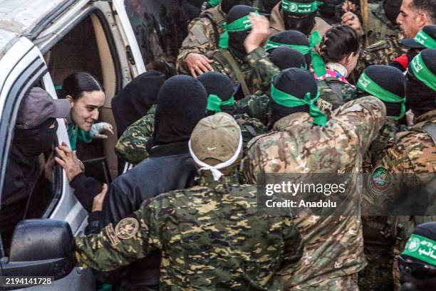 Al-Qassam Brigades hands over 3 Israeli hostages to Red Cross at al-Saraya as part of 1st phase of ceasefire and prisoner swap deal between Israel...