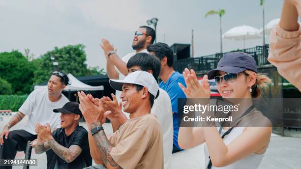 audience celebrating in skateboard competition - children clapping stock pictures, royalty-free photos & images