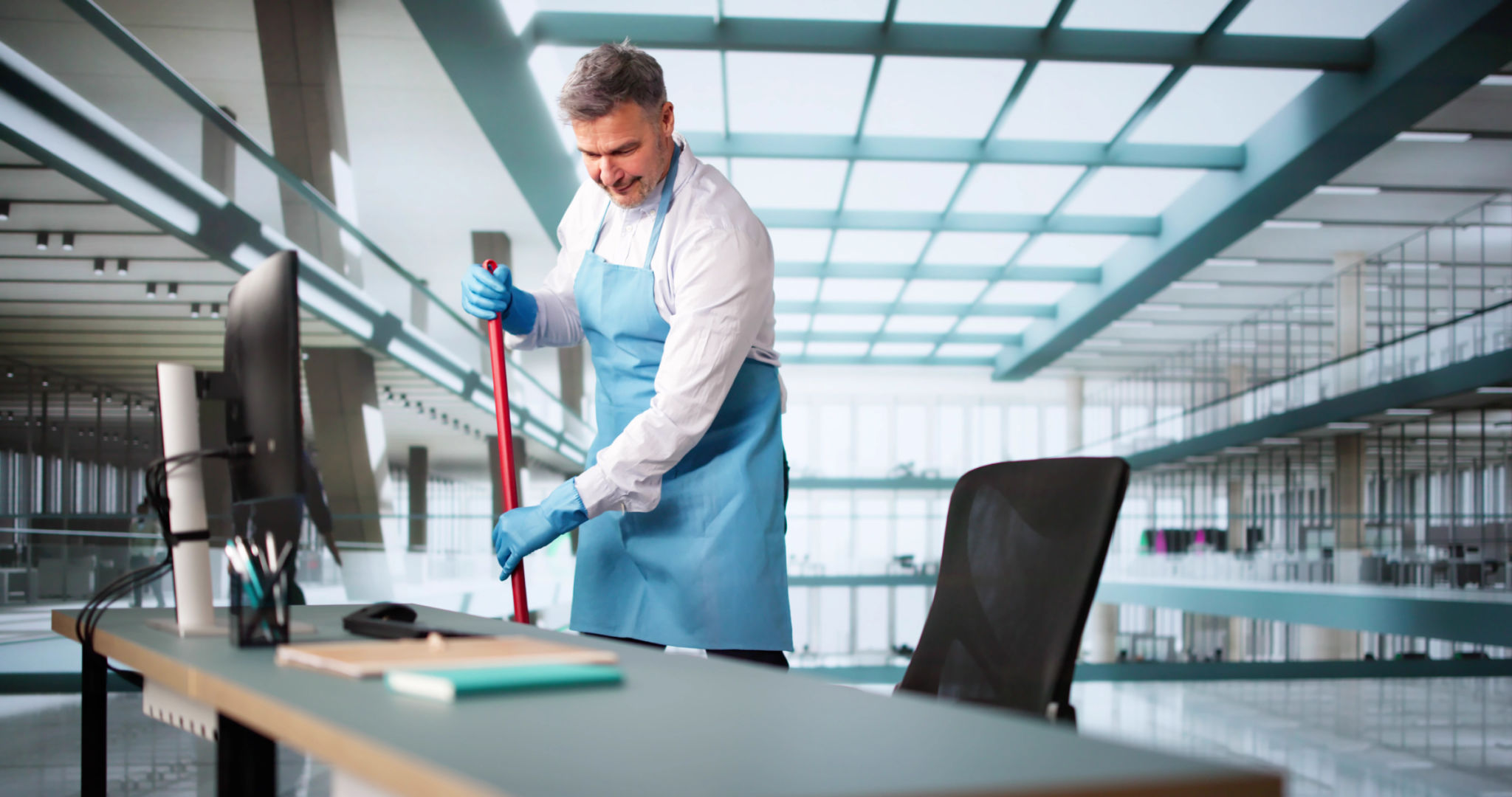 Male Janitor Cleaning Floor With Mop Male Janitor Cleaning Floor With Mop