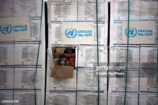 Trucks carrying humanitarian aid arrive in the Gaza Strip via the Kerem Shalom crossing, also known as Karem Abu Salem, in Gaza Strip, on January 19,...