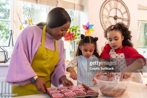 cooking up easter happiness - decorating a cake stock pictures, royalty-free photos & images