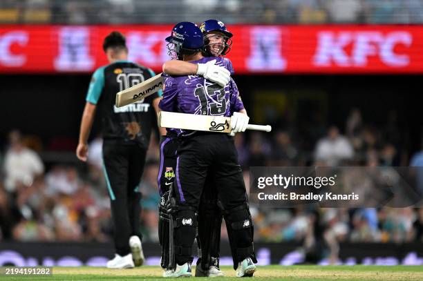 Matthew Wade and Jake Doran of the Hurricanes celebrate victory during the BBL match between Brisbane Heat and Hobart Hurricanes at The Gabba, on...