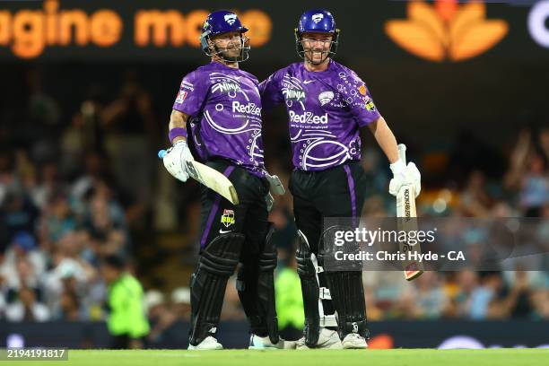 Matthew Wade and Jake Doran celebrate winning the BBL match between Brisbane Heat and Hobart Hurricanes at The Gabba, on January 16 in Brisbane,...
