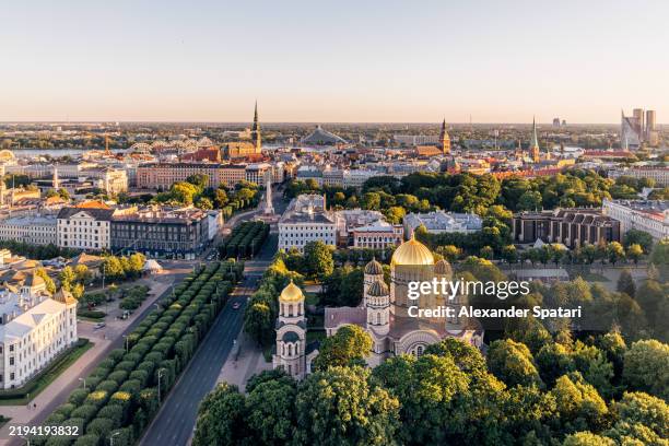 aerial view of riga cityscape with orthodox cathedral and old town in summer, latvia - riga stock-fotos und bilder