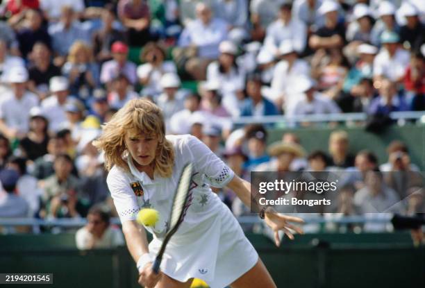 German tennis player Steffi Graf plays a backhand return during the 1988 Summer Olympics tennis competition, at the Seoul Olympic Park Tennis Center...
