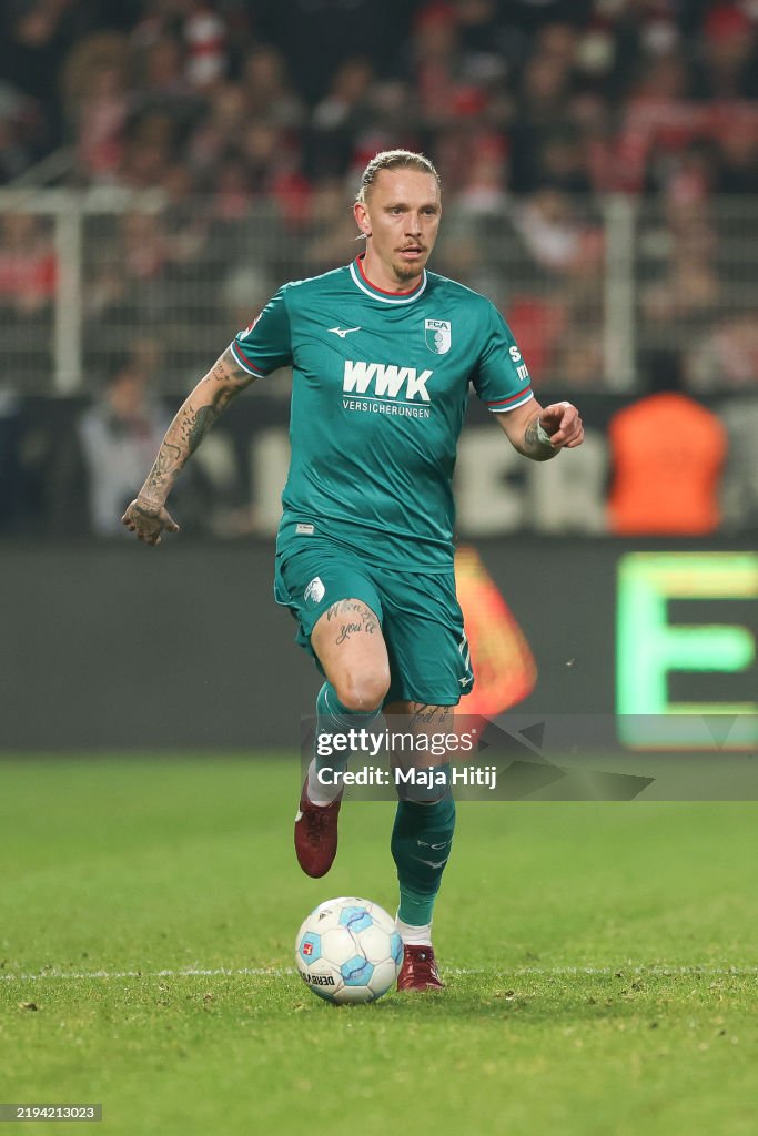 Mwolf Marius Wolf of FC Augsburg controls the ball during the Bundesliga ...