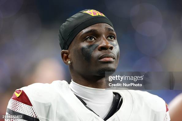 Mike Commanders Cornerback Mike Sainristil of the Washington Commanders looks up to ...