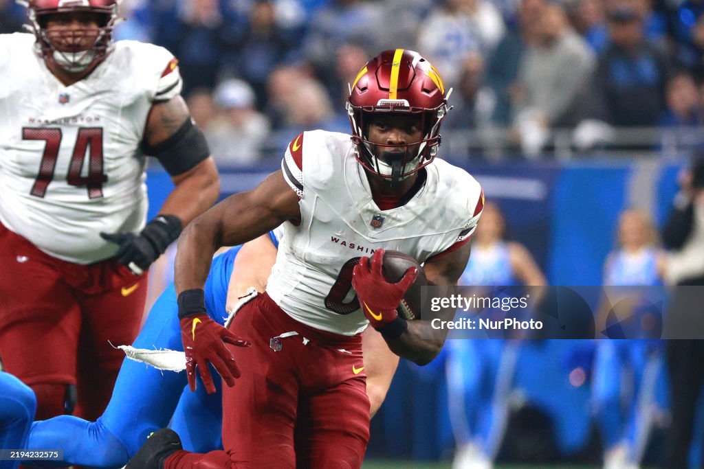 Mike Commanders Washington Commanders cornerback Mike Sainristil runs the ball during ...