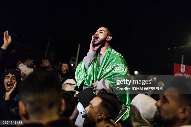 Palestinian prisoner set free by Israel in the early hours of January 20, 2025 celebrates upon his arrival in the occupied West Bank town of...