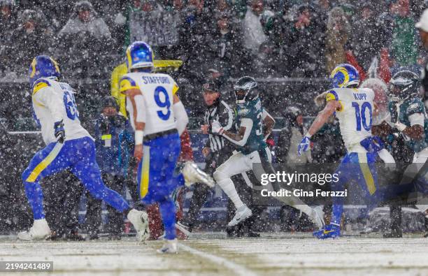 Los Angeles Rams guard Kevin Dotson , Los Angeles Rams quarterback Matthew Stafford and Los Angeles Rams wide receiver Cooper Kupp give chase to...