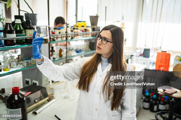 woman working in the laboratory - reagent stock pictures, royalty-free photos & images