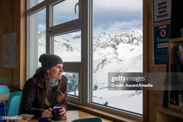 backcountry skier relaxes in ski lodge - skier isolated stock pictures, royalty-free photos & images
