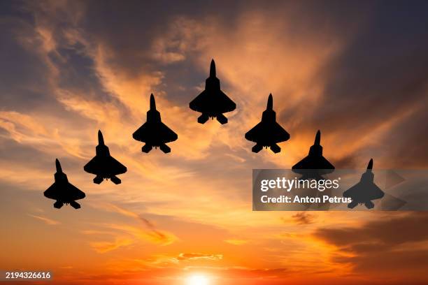 fighter jets at sunset. military aviation - avion militaire photos et images de collection